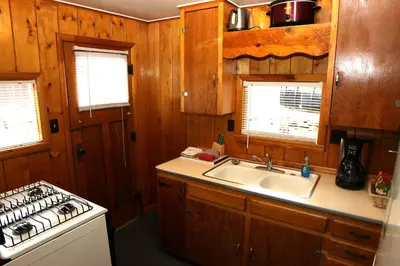 a kitchen with a sink and a stove at Lazy R Cottages- 2 cabin in Estes Park