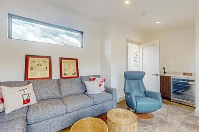 a living room with a couch and a chair at Alpine Vista Haven in Silverthorne