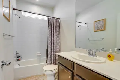 a bathroom with a sink and a tub and a toilet at Near Rocky Mountain Arsenal Commerce City Home in Henderson