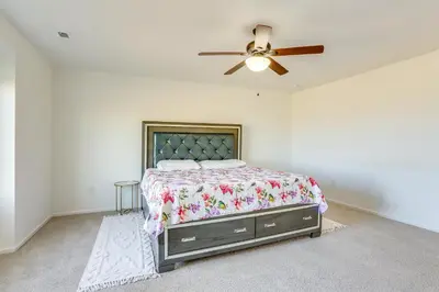 a bedroom with a bed and a ceiling fan at Near Rocky Mountain Arsenal Commerce City Home in Henderson