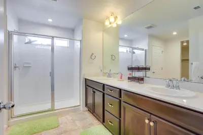 a bathroom with a shower and a sink and a mirror at Near Rocky Mountain Arsenal Commerce City Home in Henderson