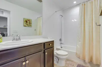 a bathroom with a sink and a toilet and a shower at Near Rocky Mountain Arsenal Commerce City Home in Henderson