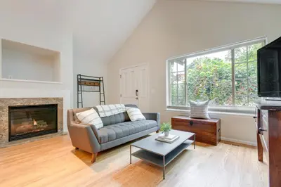 a living room with a couch and a fireplace at 1 Mi to Dtwn Stylish Denver Home with Patio in Denver