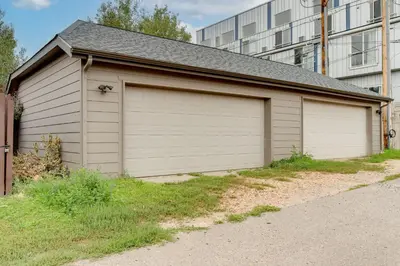 a garage with a large door on the side of it at 1 Mi to Dtwn Stylish Denver Home with Patio in Denver