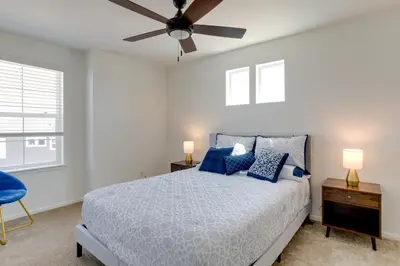 a bedroom with a bed and a ceiling fan at 9 Mi to Airport Pet-Friendly Aurora Home with Deck in Aurora