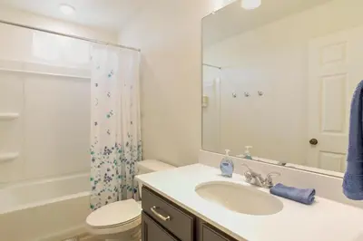 a bathroom with a sink and a toilet and a shower at 9 Mi to Airport Pet-Friendly Aurora Home with Deck in Aurora