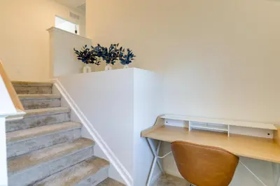a home office with a desk and stairs at 9 Mi to Airport Pet-Friendly Aurora Home with Deck in Aurora