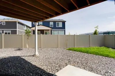 a backyard with a fence and a pole at 9 Mi to Airport Pet-Friendly Aurora Home with Deck in Aurora