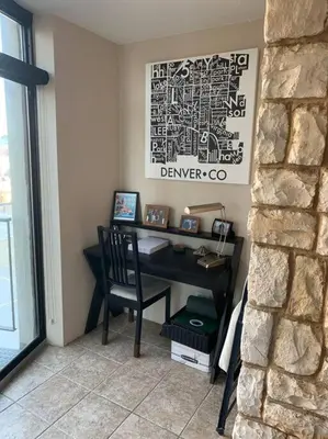 a office with a desk with a chair and a wall at 2 BR Condo Heart of LoDo w/Great View/Amenities in Denver