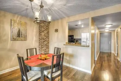 a dining room with a red table and chairs at 2 BR Condo Heart of LoDo w/Great View/Amenities in Denver
