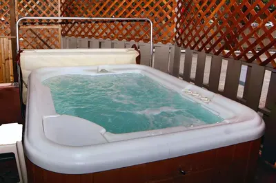 a bath tub filled with green water in at Sunnyside Knoll- 1 studio in Estes Park