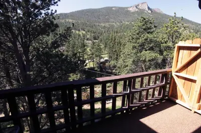 a balcony with a view of a mountain at Fawn Valley Inn- 293 condo in Estes Park