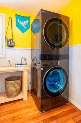 a washer and dryer in a room at Private Bungalow with Kids Playset in Denver
