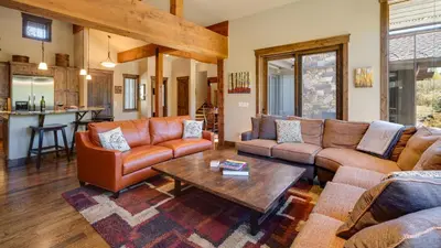 a living room with couches and a coffee table at Blue Skies at The Shores in Breckenridge