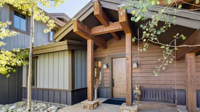 a wooden house with a wooden pergola at Blue Skies at The Shores in Breckenridge