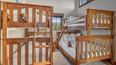 a couple of bunk beds in a room at Blue Skies at The Shores in Breckenridge