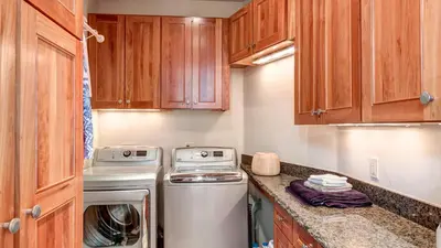 a small kitchen with a washer and dryer at Point View Place in Breckenridge