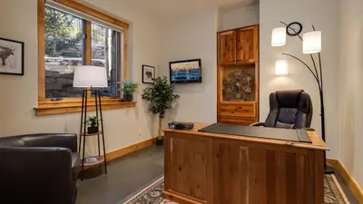 a law office with two chairs and a desk at Point View Place in Breckenridge