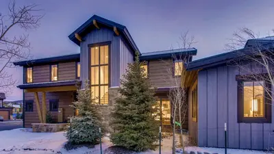 a house in the winter with snow at River Song at The Shores in Breckenridge