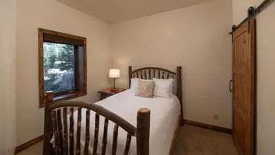 a bedroom with a bed and a window at Winterfell Estates in Breckenridge
