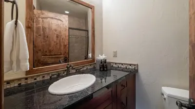 a bathroom with a sink and a mirror at Winterfell Estates in Breckenridge