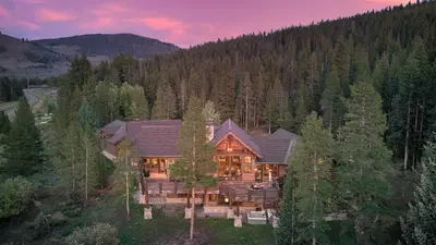 an aerial view of a large house in the woods at Winterfell Estates in Breckenridge