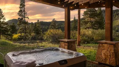 a jacuzzi tub with a view of a forest at Winterfell Estates in Breckenridge