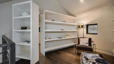 a room with white shelves and a chair at Vickerys Vantage in Breckenridge