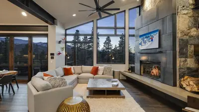 a living room with a couch and a fireplace at Vickerys Vantage in Breckenridge