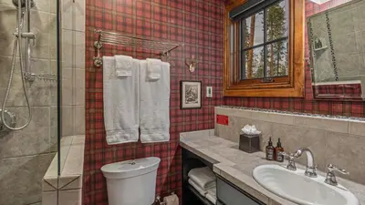 a bathroom with a toilet and a sink and a shower at Cypress Mountain Chalet in Breckenridge