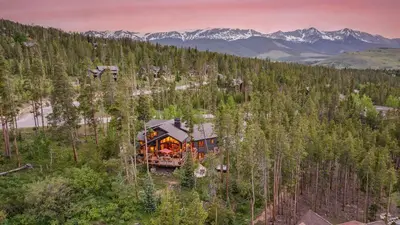 an aerial view of a train traveling through a forest at Cypress Mountain Chalet in Breckenridge