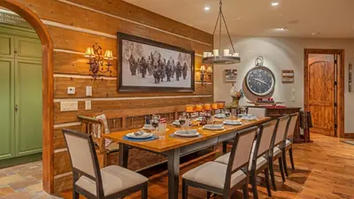 a dining room with a table and chairs at Cypress Mountain Chalet in Breckenridge