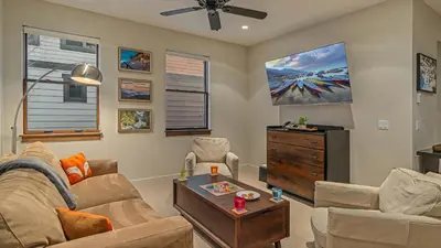 a living room with a couch and a table at On the Corner at The Shores in Breckenridge