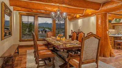 a dining room with a wooden table and chairs at Monte Video in Breckenridge