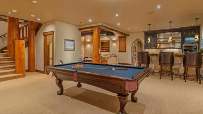 a room with a pool table in a house at Monte Video in Breckenridge