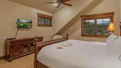 a bedroom with a bed and a tv and a window at Monte Video in Breckenridge