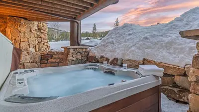 a jacuzzi tub in a stone building at Monte Video in Breckenridge