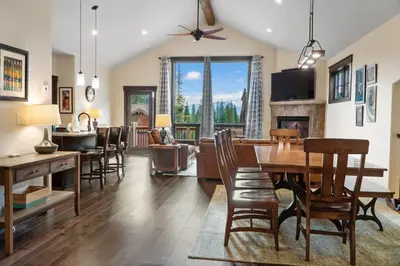 a dining room and living room with a table and chairs at 4BD Family Friendly Minutes from River Run Gondola in Keystone