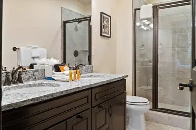 a bathroom with a shower and a sink and a toilet at 4BD Family Friendly Minutes from River Run Gondola in Keystone
