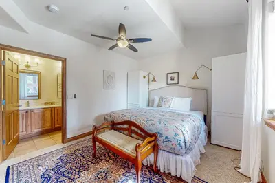 a bedroom with a bed and a ceiling fan at Blue River Grove in Silverthorne
