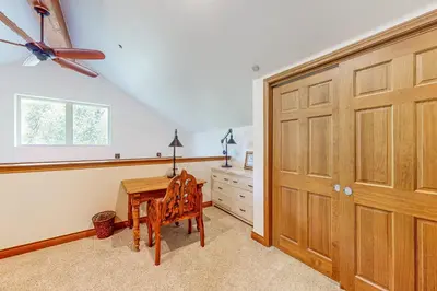 a room with a wooden door and a wooden desk at Blue River Grove in Silverthorne