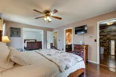 a bedroom with a bed and a ceiling fan at Spacious Aurora Retreat with Game Room and Hot Tub! in Aurora
