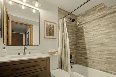 a bathroom with a tub and a sink and a shower at Stunning View House - 15-min to Town - Evergreen in Evergreen