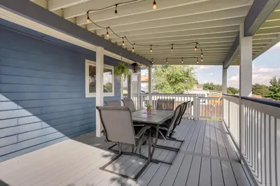 a patio with a table and chairs on a deck at Furnished Deck and Fire Pit Thornton Family Retreat in Thornton