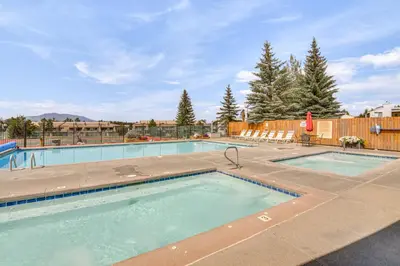 a swimming pool with two lanes in a resort at Elevated Fraser Condo with Mountain View and Amenities in Fraser