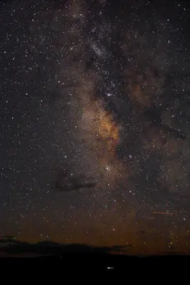 a starry night with the milky way in the sky at Red-tail Roundhouse at 22 West Cabins and Recreation in Hebron