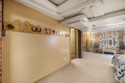 a corridor of a room with a wall with a shelf with a sign on it at Your Vacation House ---EV#3216 home in Estes Park