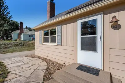 a house with a white door on the side of it at Your Vacation House ---EV#3216 home in Estes Park