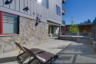 a couple of chairs sitting outside of a building at Stunning Winter Park Condo Near Slopes! in Winter Park