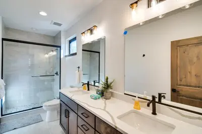 a bathroom with a sink and a shower and a toilet at Ski-InandOut Home with Hot Tub in Granby Ranch Resort! in Granby
